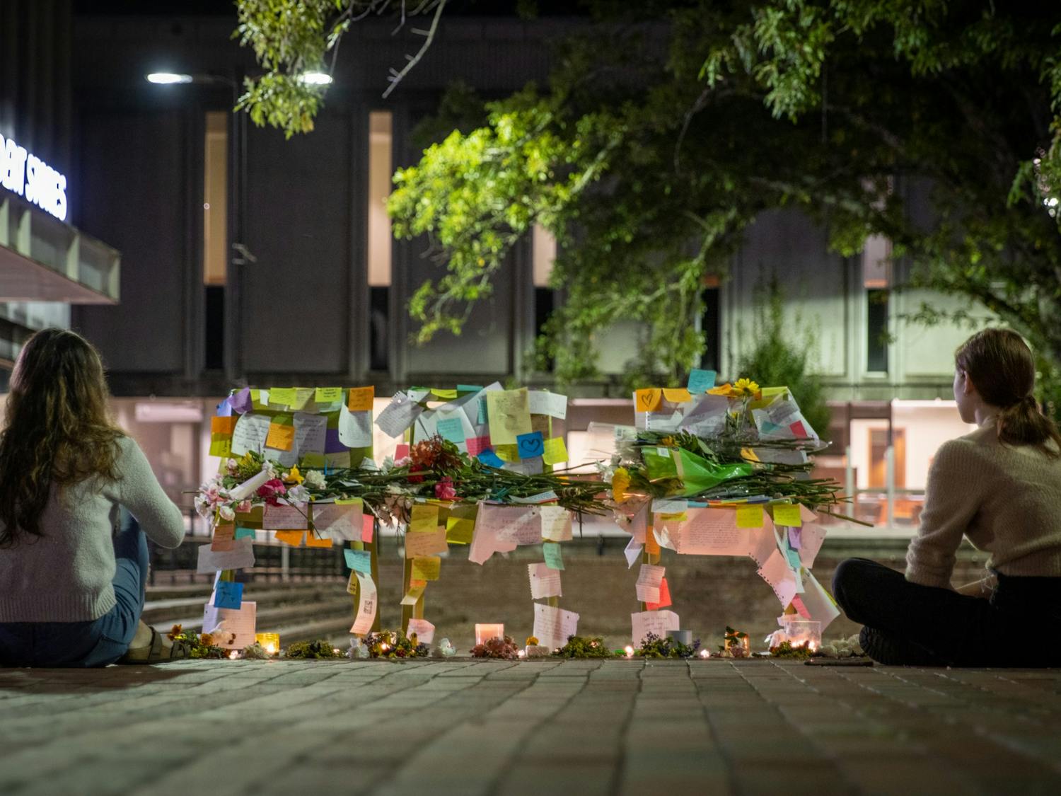 A makeshift memorial was set up in the Pit on Monday as students and faculty mourned the losses of the weekend. Passersby left notes of encouragement and flowers.