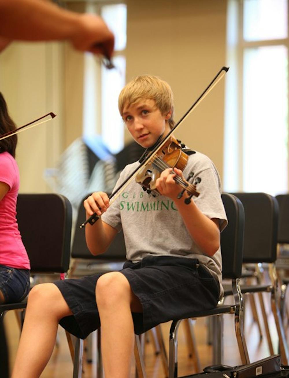 	Mason Allen listens closely to a lesson on improvisation taught by Scott Laird. DTH/Stephen Mitchell