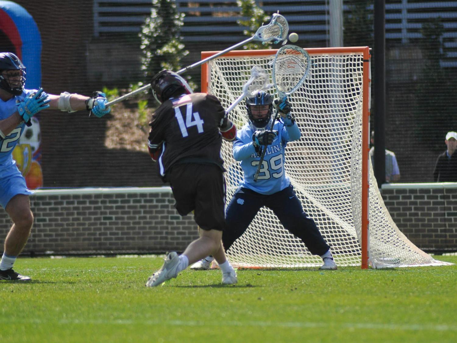 UNC junior goalkeeper Collin Krieg (39) blocks a shot during the men's lacrosse game against Brown at Dorrance Field on Saturday, March 11, 2023. UNC won 19-6.