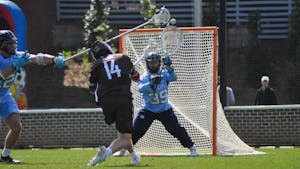 UNC junior goalkeeper Collin Krieg (39) blocks a shot during the men's lacrosse game against Brown at Dorrance Field on Saturday, March 11, 2023. UNC won 19-6.