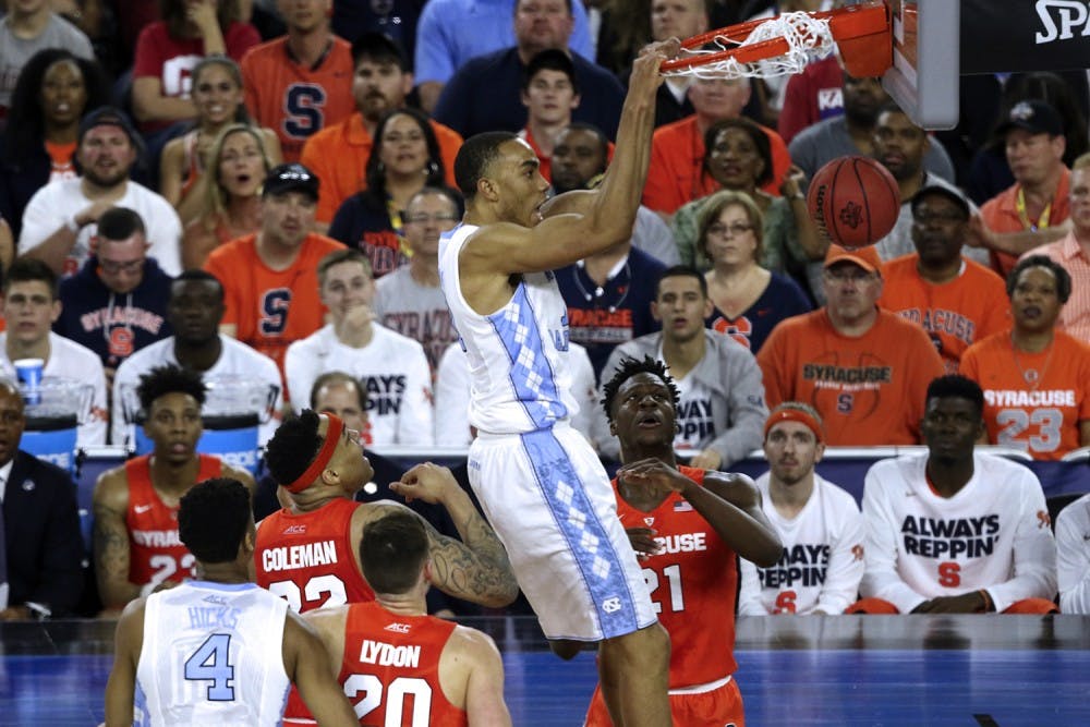 Brice Johnson (11) dunks the ball during the semi-final game against Syracuse in the NCAA Tournament.