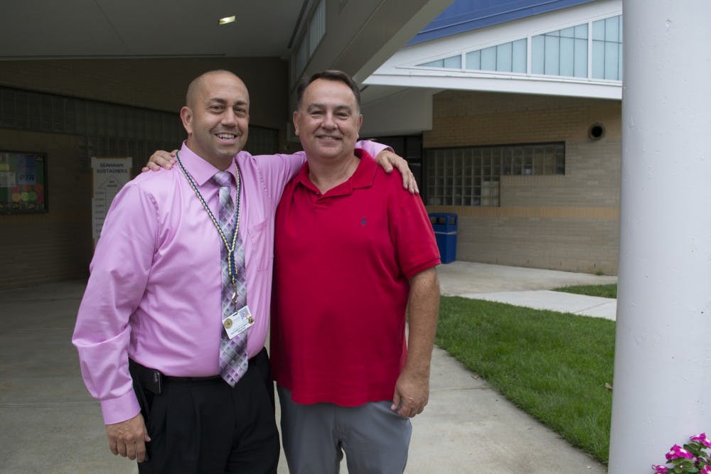 Current Principal of Southwest Elementary, Nick Rotosky (left), poses with mentor and former Principal David Sneed (right) at Southwest Elementary in Durham, NC on Monday, Sept. 24.