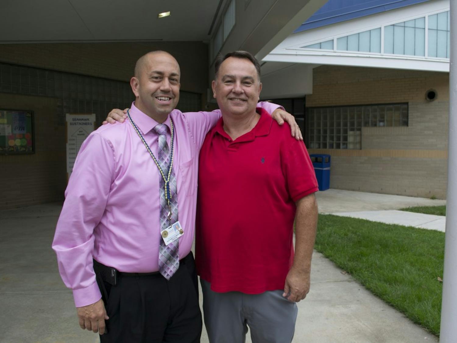 Current Principal of Southwest Elementary, Nick Rotosky (left), poses with mentor and former Principal David Sneed (right) at Southwest Elementary in Durham, NC on Monday, Sept. 24.