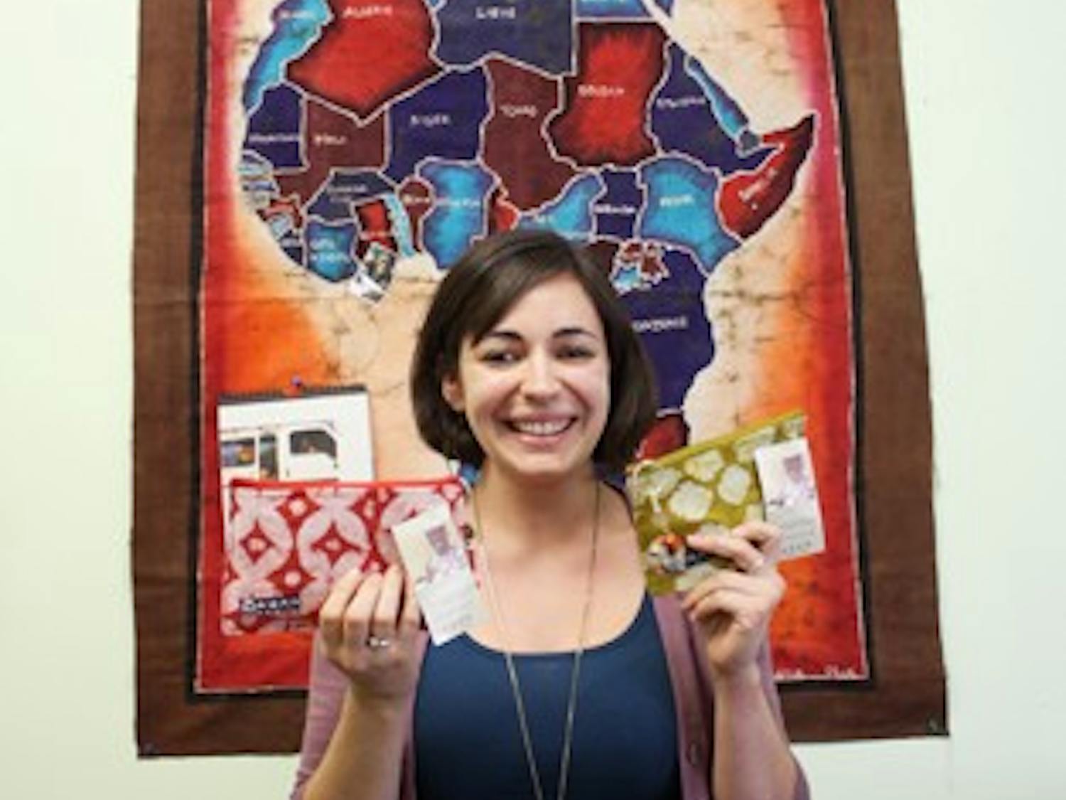 Mary Kathryne Hutton, a 2009 UNC graduate and internship coordinator at ABAN, holds some of ABAN's products.  ABAN is a group which empowers and helps Ghanan street girls get off the streets by teaching them a trade.  "The first class of women will be graduating at the end of the summer," said Hutton.