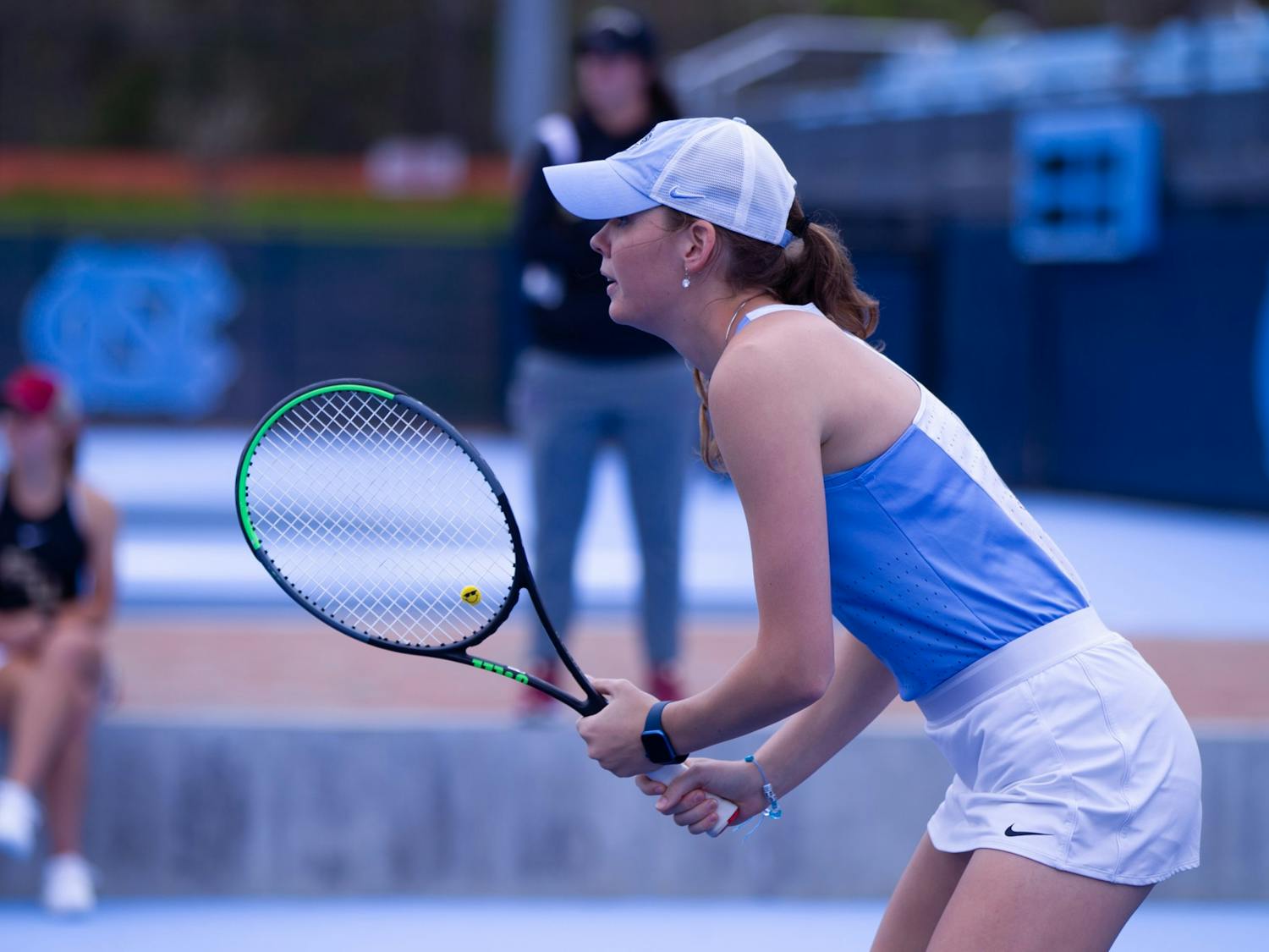 UNC senior Elizabeth Scotty looking at her opponents during a match against the Florida State University Seminoles at the Cone-Kenfield Tennis Center on Friday, March 31, 2023. The Tar Heels won 6-1.