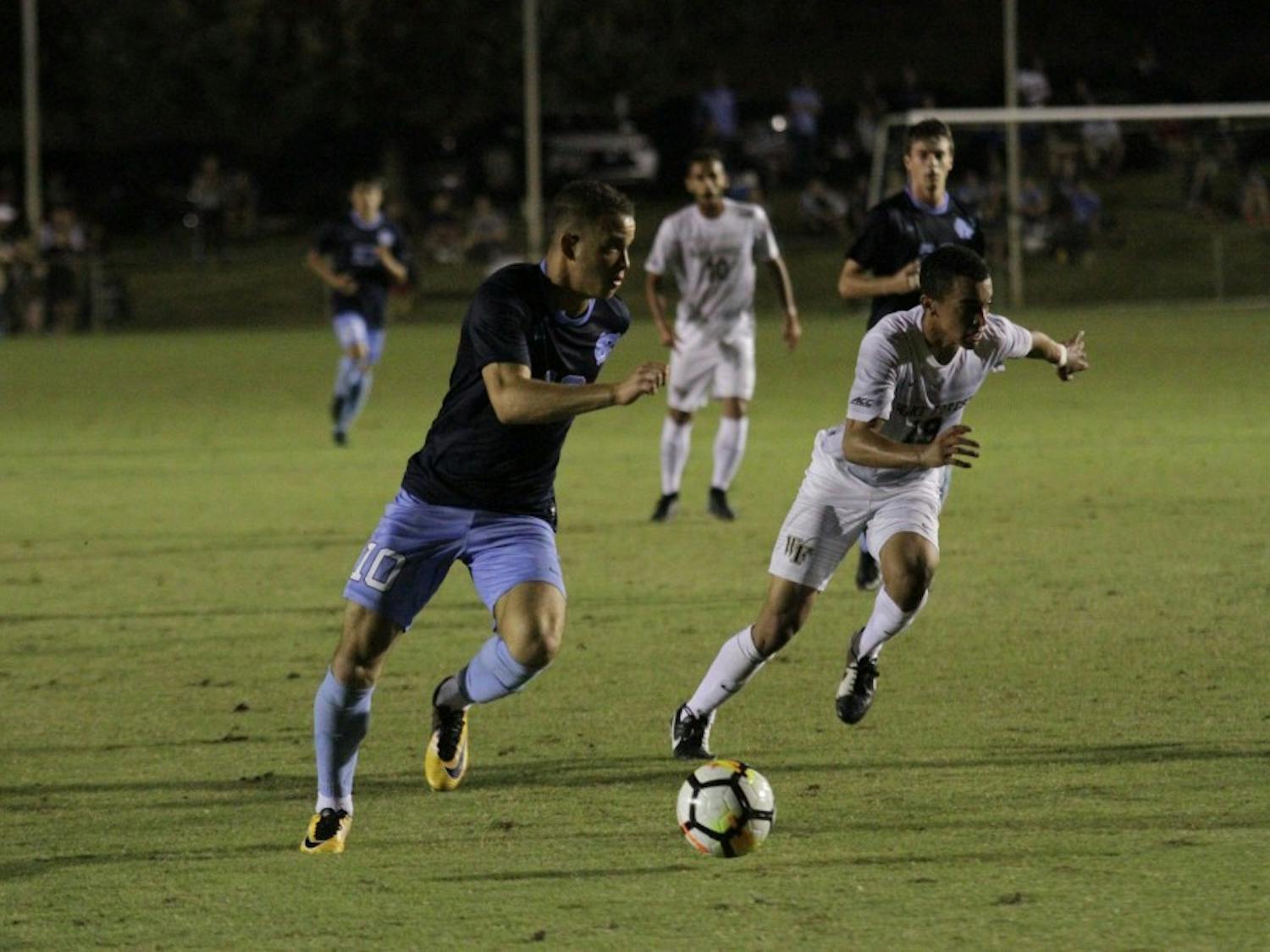 Senior forward Zach Wright (10) advances the ball against Wake Forest on Oct. 6.