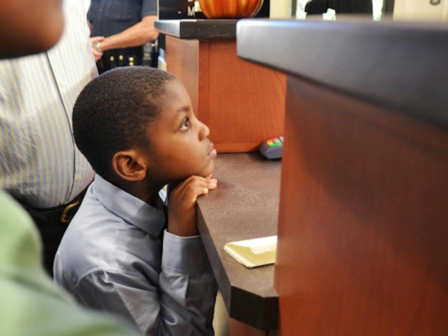 5 year old Oliver watching as his parents' aplpication for a marriage license gets denied