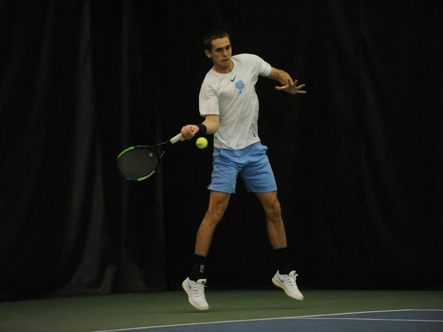 Sophomore Benjamin Sigouin, undeclared major, playing for the UNC men's tennis team against Duke on Jan. 26, 2019, in the Cone-Kenfield Tennis Center. UNC won 4-1 against Duke.