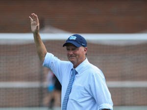 UNC women's soccer team head coach Anson Dorrance waves to the crowd as he is being recognized during halftime of the soccer game against the Notre Dame Fighting Irish on Sunday, Sept. 29th, 2019 at Dorrance Field. This marked the official name change of the stadium from UNC Soccer and Lacrosse Stadium to Dorrance Field.