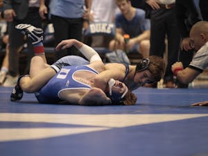 UNC's Joe Heilmann and Duke's Harrison Campbell compete in a match at Cameron Indoor Stadium on Friday, Feb. 22, 2019. UNC won 23-16.