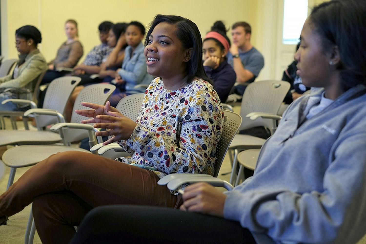 (From left to right) Asia Gandy, and Joia Freeman share their experiences with the attendees of the Token Black Girl Event Wednesday afternoon.  