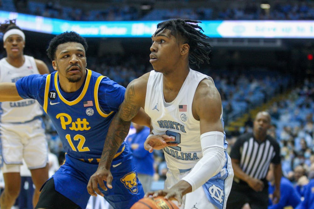 Sophomore guard Caleb Love (2) runs with the ball at the game against Pittsburgh on Feb. 16, 2022 at the Smith Center. UNC lost 76-67.