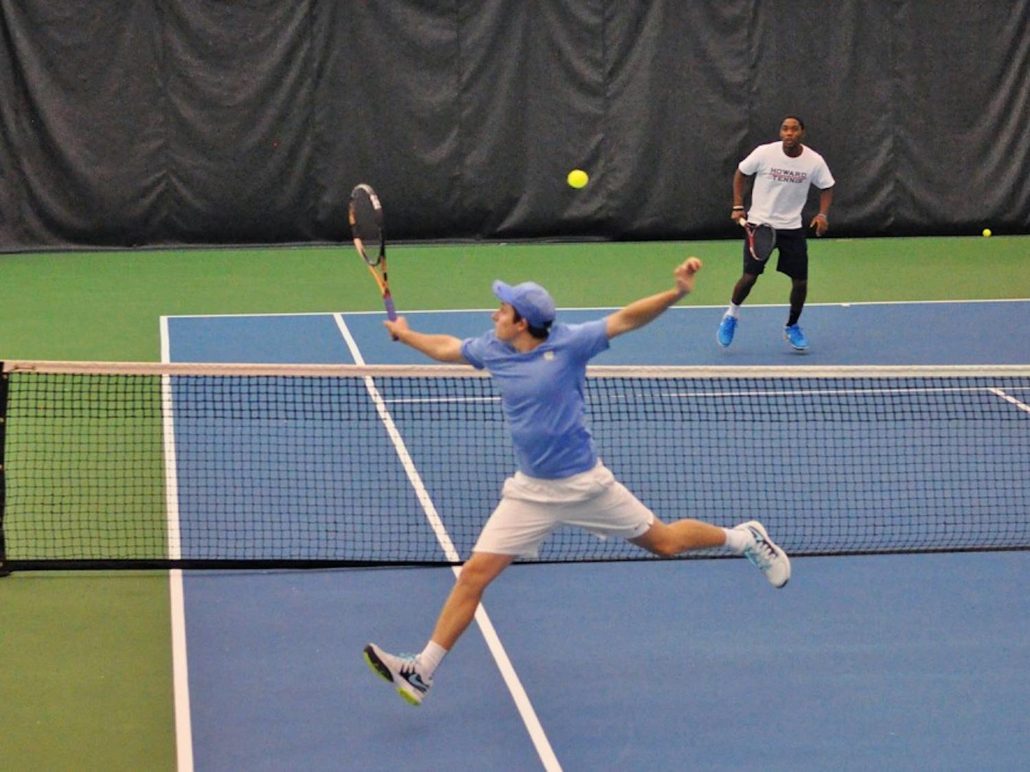 UNC junior Connor Daly reaches for a volley against Howard in a doubles match. 