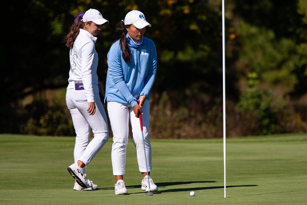 <p>DTH File. Stephany Kim, a first-year member of the UNC women's golf team, guides the ball on day three of the Ruth's Chris Tar Heel Invitational on Oct. 17, 2021. UNC finished sixth in the ACC Championship.</p>