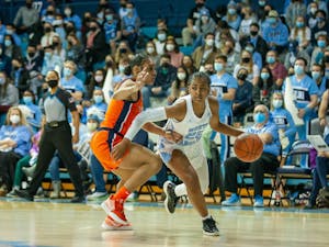 Sophomore guard Deja Kelly (25) runs with the ball at the game against Virginia on Jan. 20, 2022 at Carmichael Arena. UNC won 61-52.