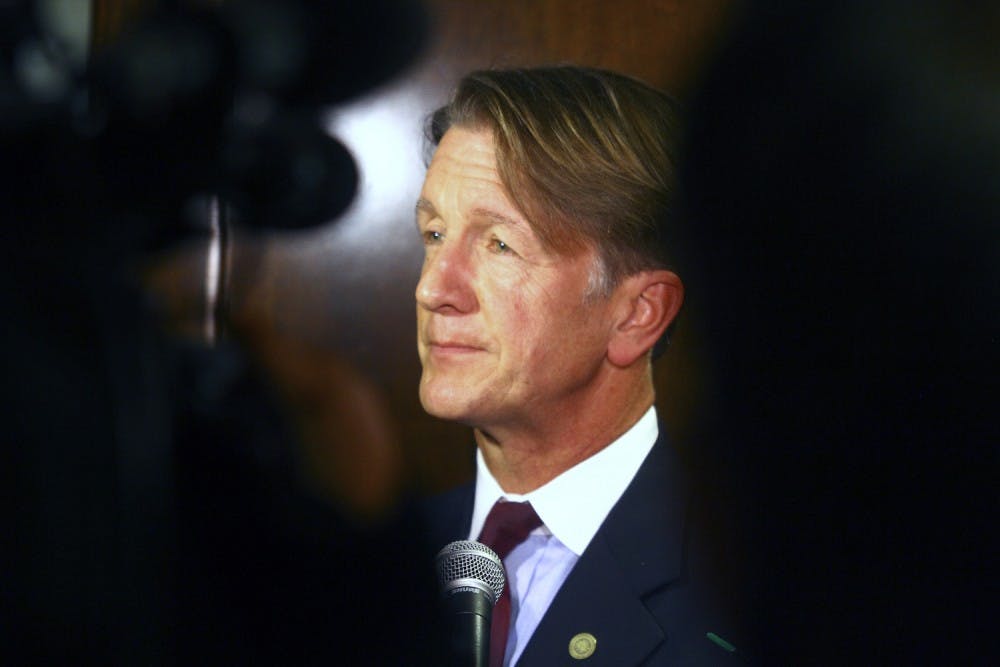 <p>UNC-system Board of Governors member and former N.C. state senator Thom Goolsby speaks to a reporter in the C.D. Spangler Building in Chapel Hill&nbsp;on Friday.</p>
