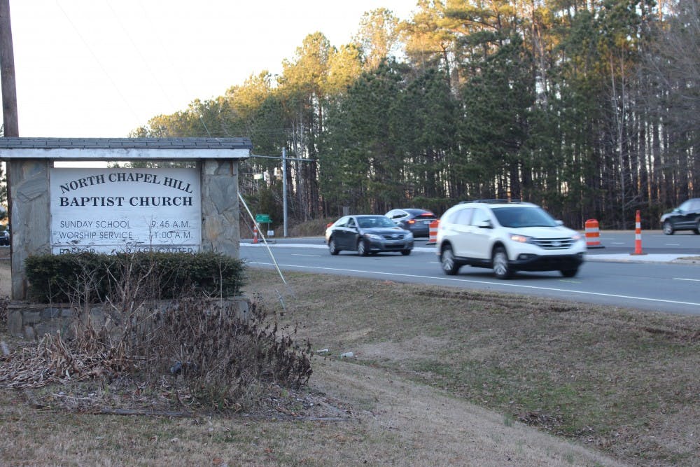 <p>Cars drive by the entrance to North Chapel Hill Baptist Church, on Monday, Jan. 28, 2019, in Chapel Hill, NC. The church and it's adjacent graveyard, located at the intersection of Interstate 40 and Eubanks Road, will be effected if the North Carolina Department of Transportation keeps it's originally proposed Interstate 40 widening plan.</p>