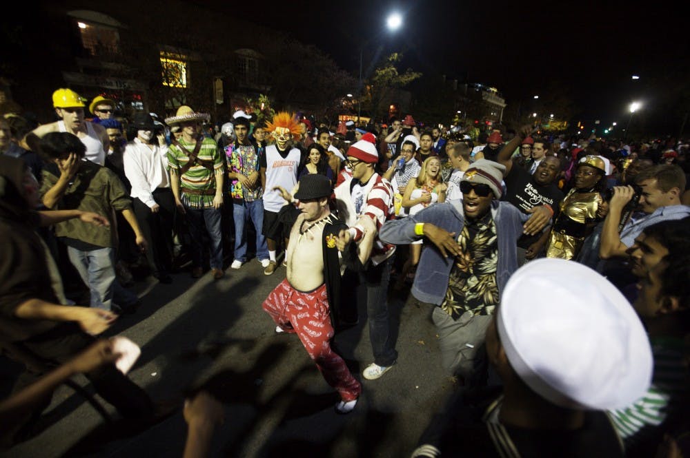 A crowd celebrates Halloween on Franklin Street in 2009. Police will treat Saturday as Homecoming, and do not expect two Halloweens.