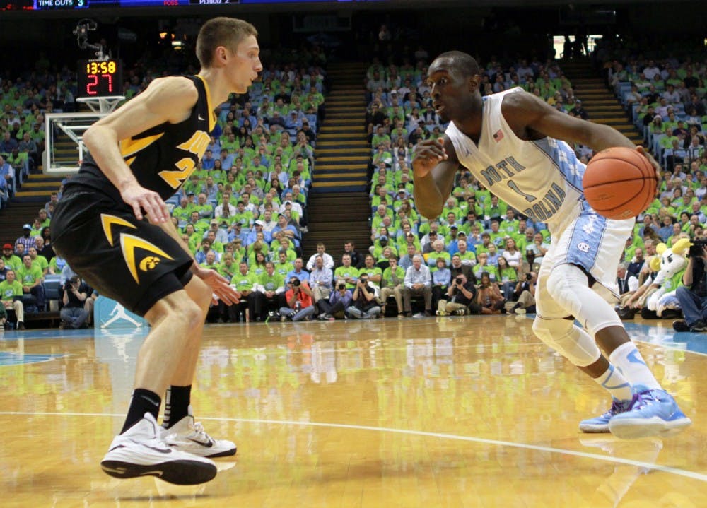 UNC freshman Theo Pinson (1) drives to the basket.