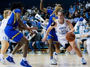 Redshirt-junior guard Eva Hodgson (10) runs with the ball at the women's basketball game against Pittsburgh on Feb. 10, 2021 at Carmichael Arena in Chapel Hill. UNC won 64-54.