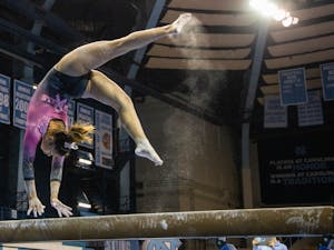 Sophomore Emery Summey performs her beam routine during the gymnastics meet against the University of New Hampshire in Carmichael Arena on Monday, Feb. 17, 2020. The Tar Heels placed first against the Wildcats.