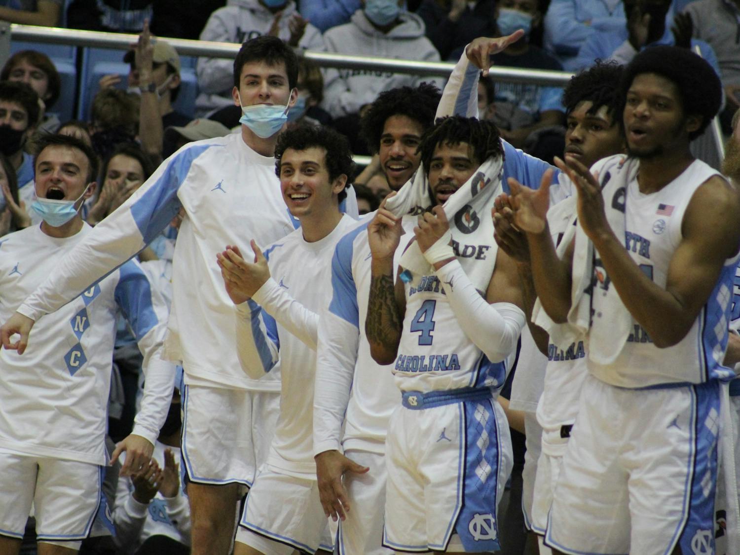 The bench celebrates a Tar Heel basket during UNC men's basketball's 72-53 win against UNC Asheville on Tuesday, Nov. 23, 2021, in the Dean E. Smith Center. 