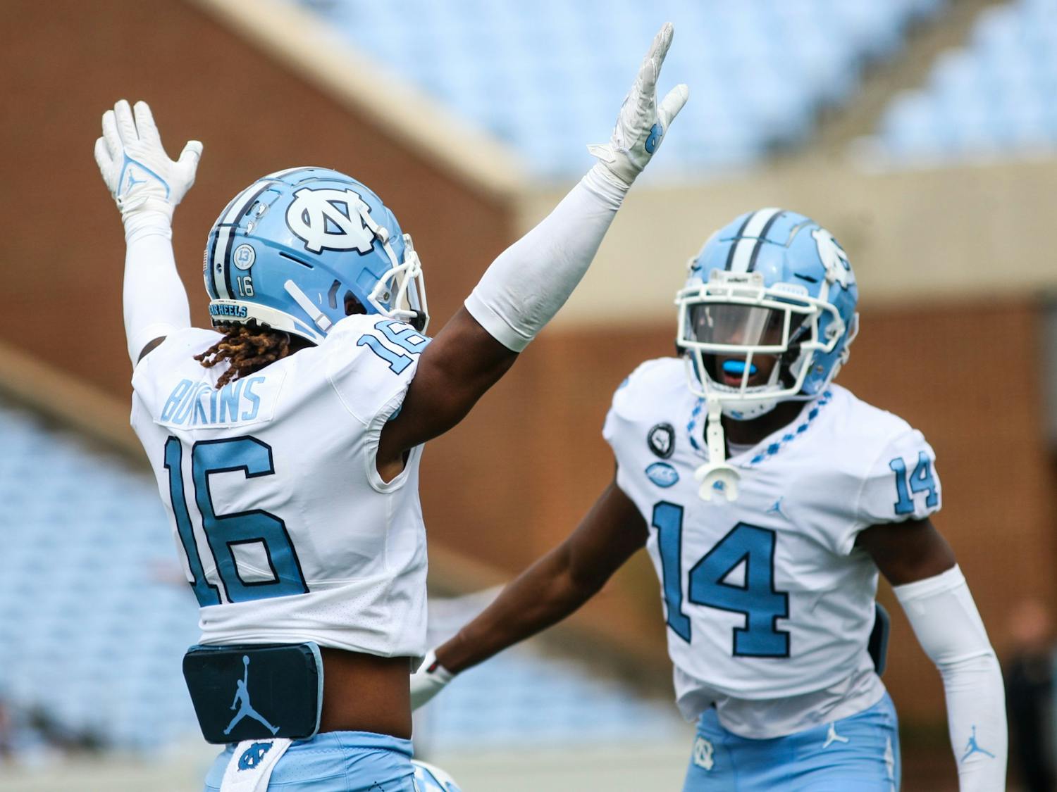 Redshirt freshman defensive back Dontae Balfour (14) and sophomore defensive back Deandre Boykins (16) celebrate a complete pass during the Spring Game on Saturday, April 9, 2022. The Tar Heels and Carolina tied, 14-14.