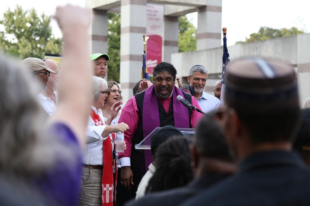 Rev. Dr. William J. Barber II speaks about the history of voters' rights in the U.S. at the rally on Thursday. 

The NAACP lead a march and rally in Raleigh on Thursday as part of "America's Journey for Justice," a 806-mile march from Selma, Alabama, to Washington D.C. Hundreds gathered in the Bicentennial Plaza to protest for voters' rights. 