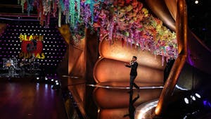 Trevor Noah emerges from a flower-adorned gramophone during a pretaped segment for the 63rd Grammys at the Los Angeles Convention Center on March 11, 2021. Photo courtesy of Robert Gauthier/Los Angeles Times/TNS.