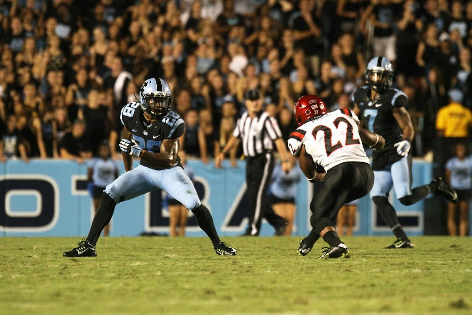 UNC cornerback Brian Walker (28) defends San Diego State's Kalan Montgomery (22).  Walker would go on to make the game saving interception late in the game.