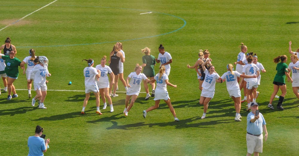 <p>Members of the UNC women’s lacrosse team dance &nbsp;to the fight song after defeating Northwestern, 20-9, on Sunday, March 6, 2022.</p>
