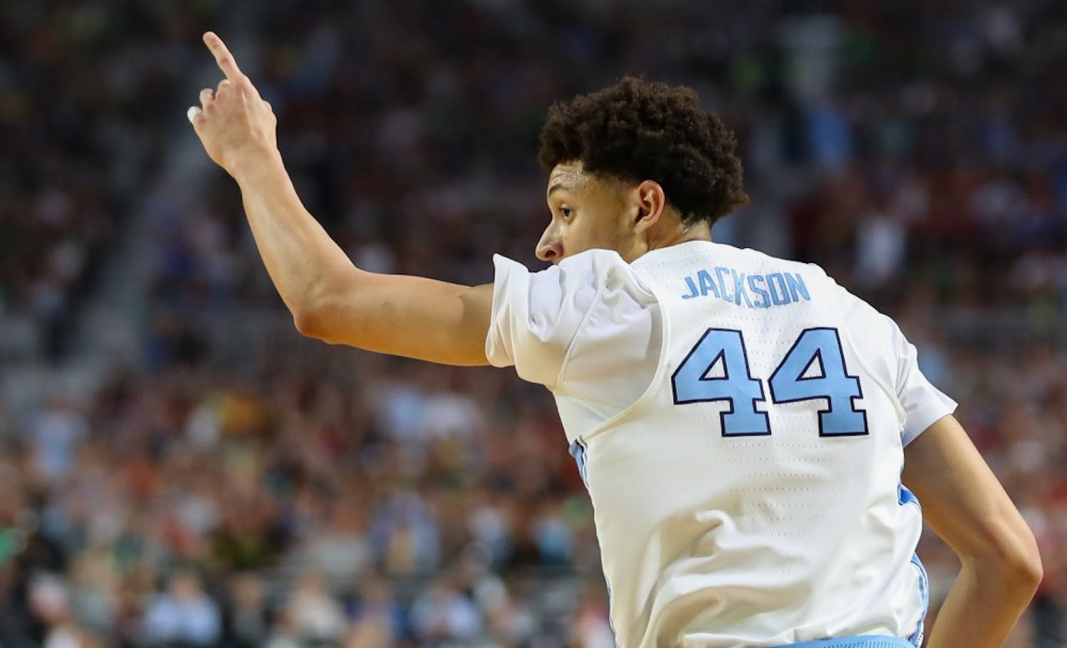 North Carolina wing Justin Jackson (44) points to the bench after hitting a 3-pointer against Oregon in the teams' Final Four matchup on Saturday in Phoenix.