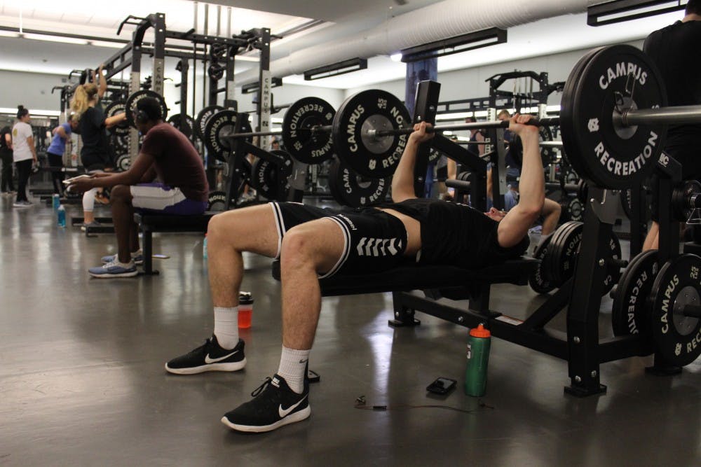 <p>Aaron Hamm, a sophomore chemistry major at the time, utilizes the bench press at the Student Recreation Center on Oct. 24, 2018.&nbsp;</p>