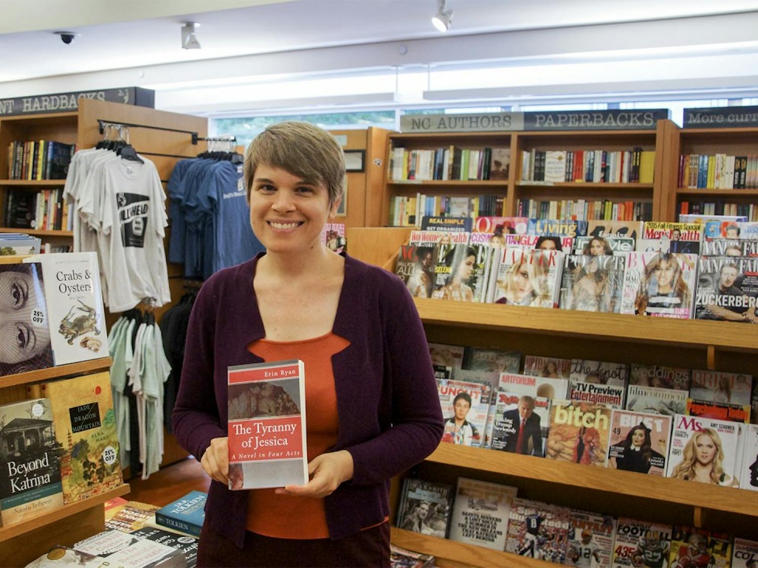 Erin Ryan, a graduate student in the School of Information and Library Sciences, poses with her book “The Tyranny of Jessica.”