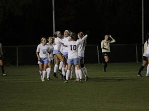 The North Carolina women's soccer team celebrates its 1-0 win over Colorado in the second round of the NCAA Tournament on Friday night at WakeMed Soccer Park in Cary.