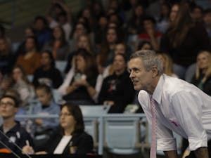 Gymnastics Head Coach Derek Galvin watches UNC compete against University of Oklahoma and Ball State University on Saturday, Jan. 19, 2019 in Carmichael Arena.