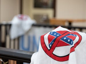A shirt depicting an anti-confederate symbol is draped over a banister on the second flood of the Campus Y. The shirts were left there by a vandal who broke in over the weekend of Jan. 23-24, 2021.