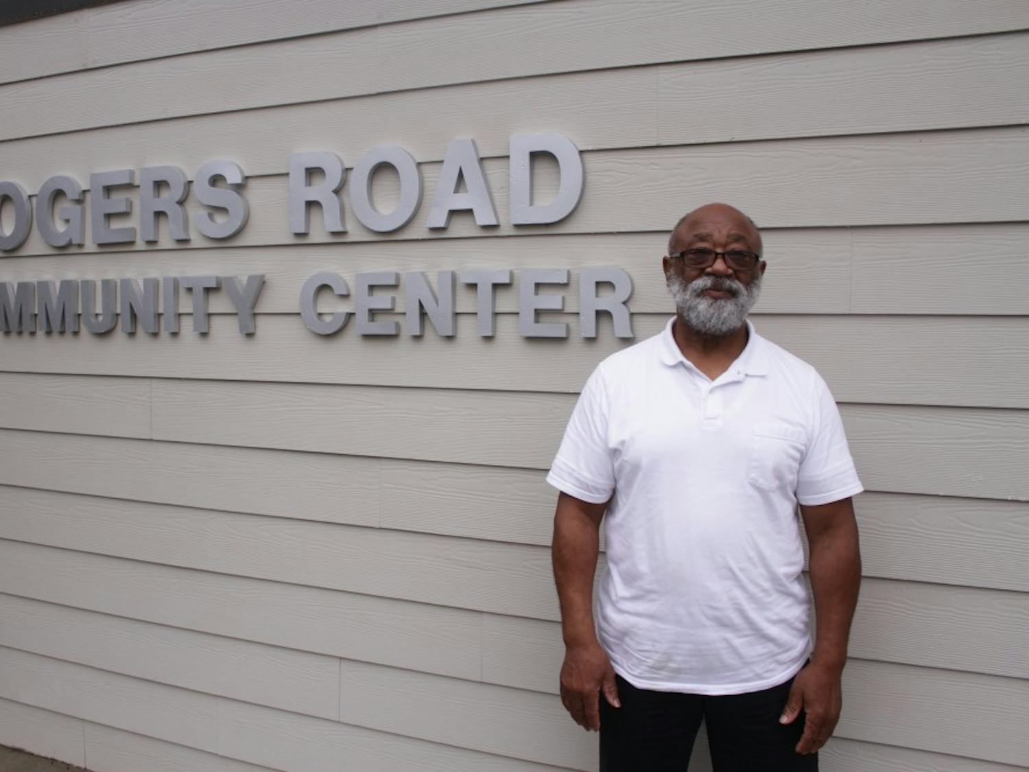 Rev. Campbell poses for a portrait in front of the Rogers Road Community Center.