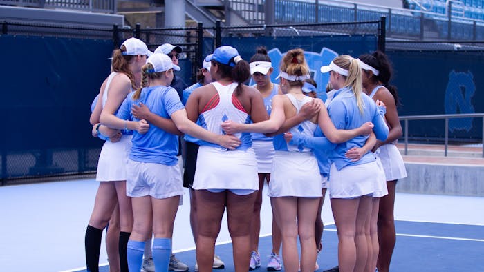 The UNC women’s tennis team before matches against the Florida State University Seminoles at the Cone-Kenfield Tennis Center on Friday, March 31, 2023. The Tar Heels won 6-1.