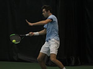 UNC's Benjamin Sigouin returns a shot against Texas Christian on Feb. 5 in the Cone-Kenfield Tennis Center.