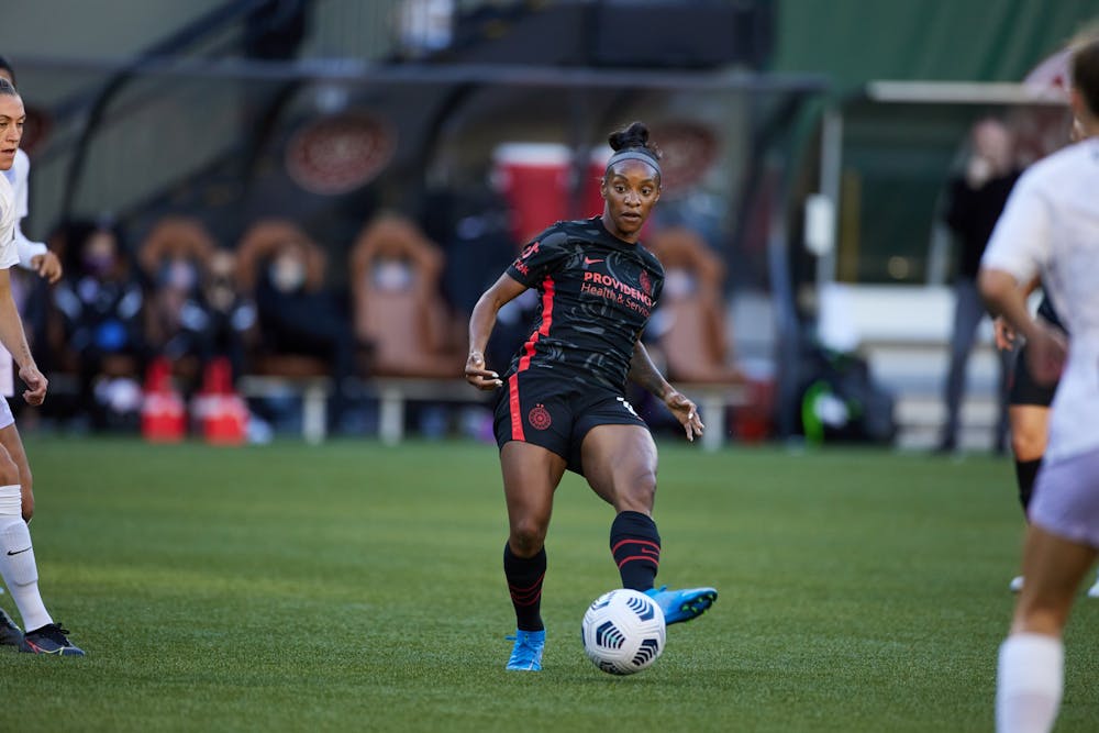 Crystal Dunn passes the ball during the Portland Thorns' game against Racing Louisville at Providence Park in Portland, OR on June 5, 2021. Photo by Craig Mitchelldyer/Portland Thorns FC
