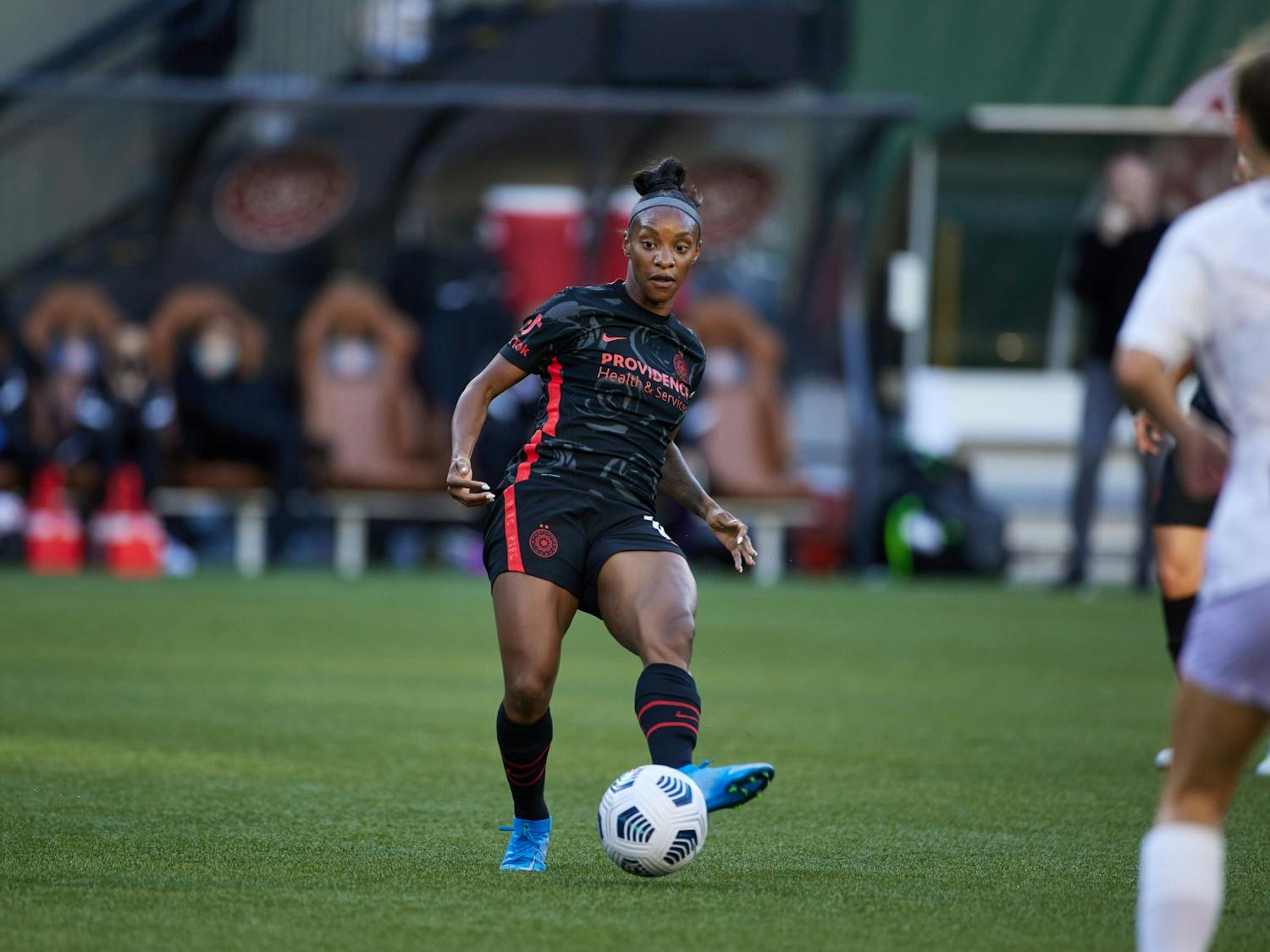 Crystal Dunn passes the ball during the Portland Thorns' game against Racing Louisville at Providence Park in Portland, OR on June 5, 2021. Photo by Craig Mitchelldyer/Portland Thorns FC