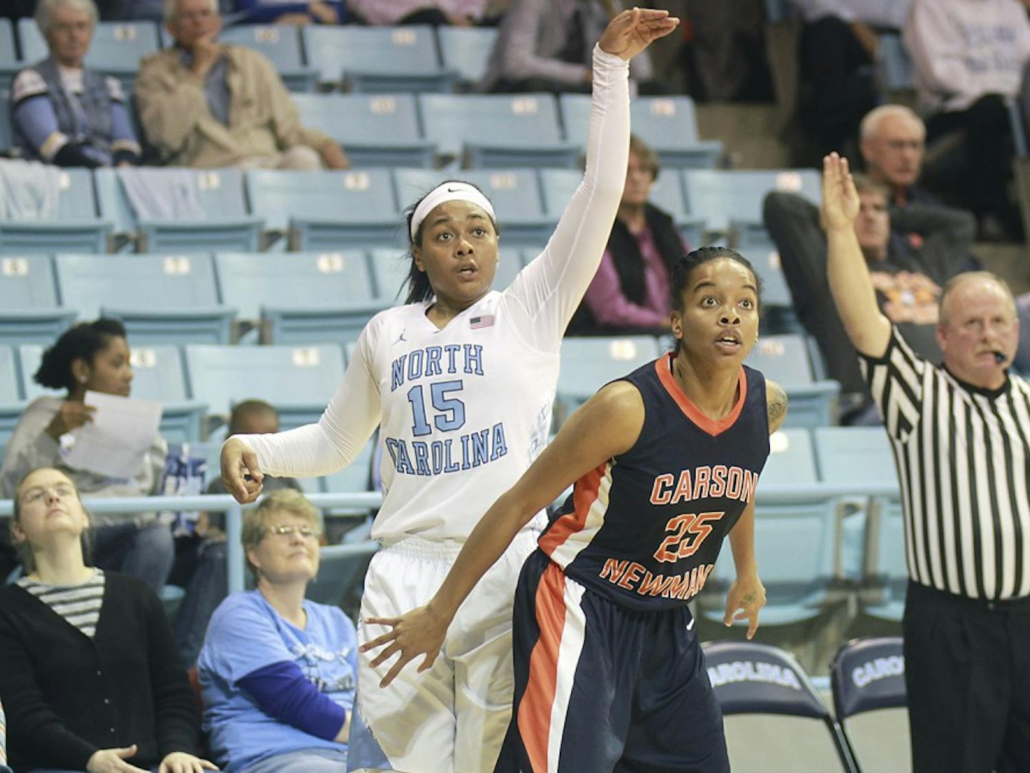 Sophmore guard Allisha Gray watches the ball as she scores a three pointer during the tar heel's first exhibition game of the season.