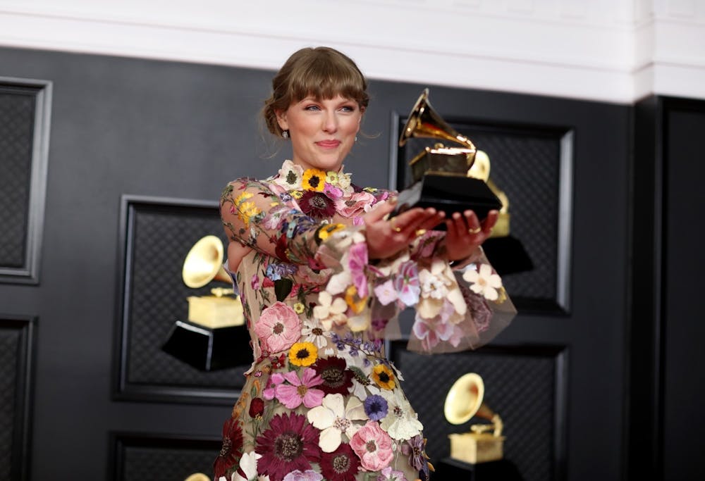 Taylor Swift with her Grammy for winning Album of the Year on the red carpet at the 63rd Annual Grammy Awards, at the Los Angeles Convention Center, in downtown Los Angeles, CA, Sunday, Mar. 14, 2021. Photo courtesy of Jay L. Clendenin/Los Angeles Times/TNS.