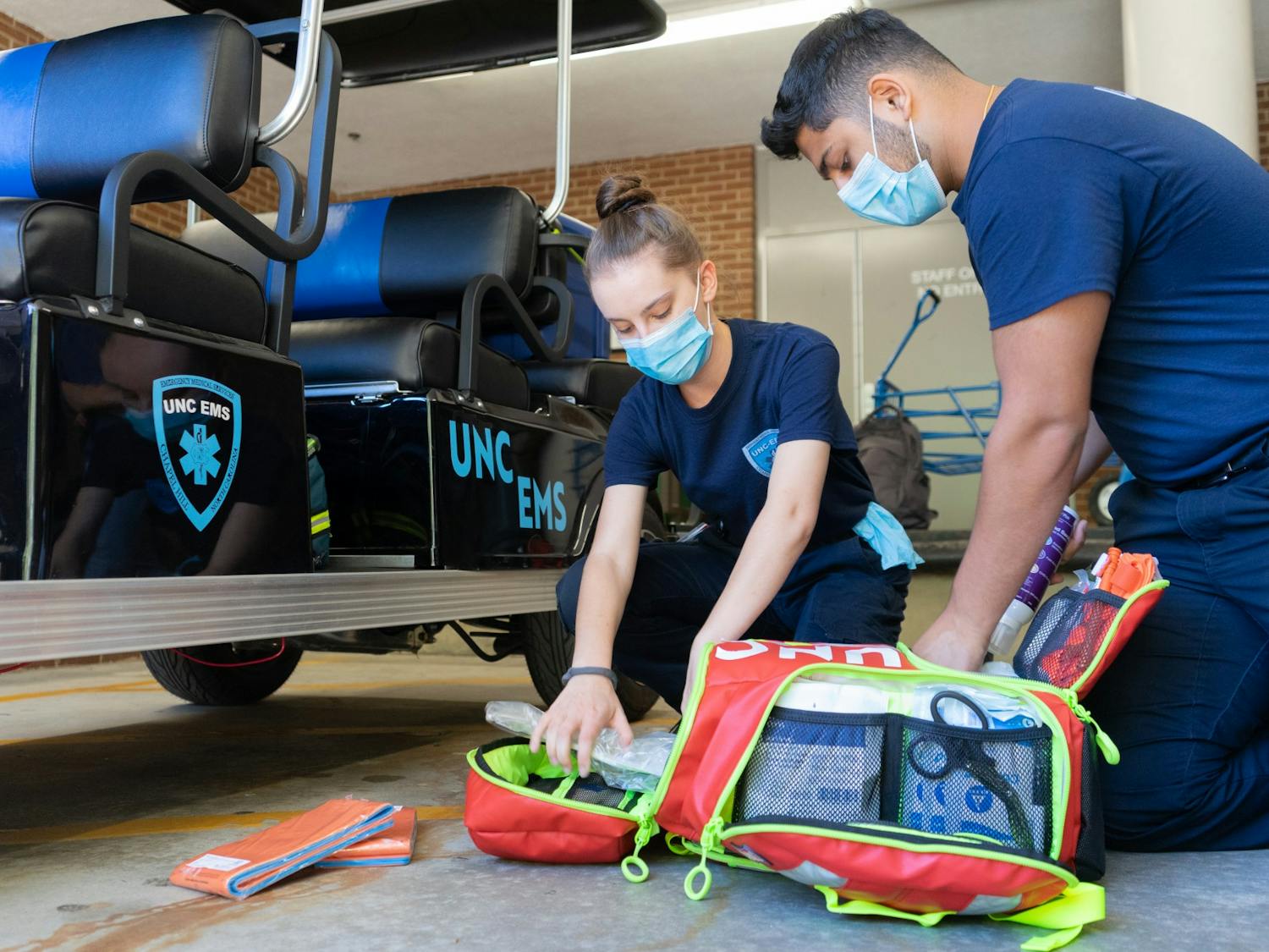 UNC Senior Ishan Khosla and Junior Sarah Torzone show what is kept in their emergency kit on Wednesday, Oct. 20, 2021.