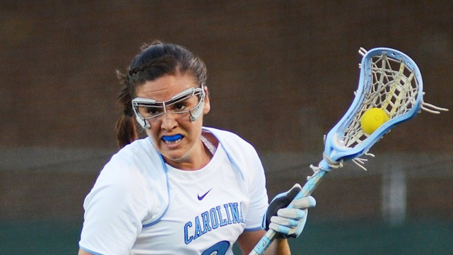 UNC midfielder Margaret Corzel (9) brings the ball out of the defensive zone after forcing a turnover. 