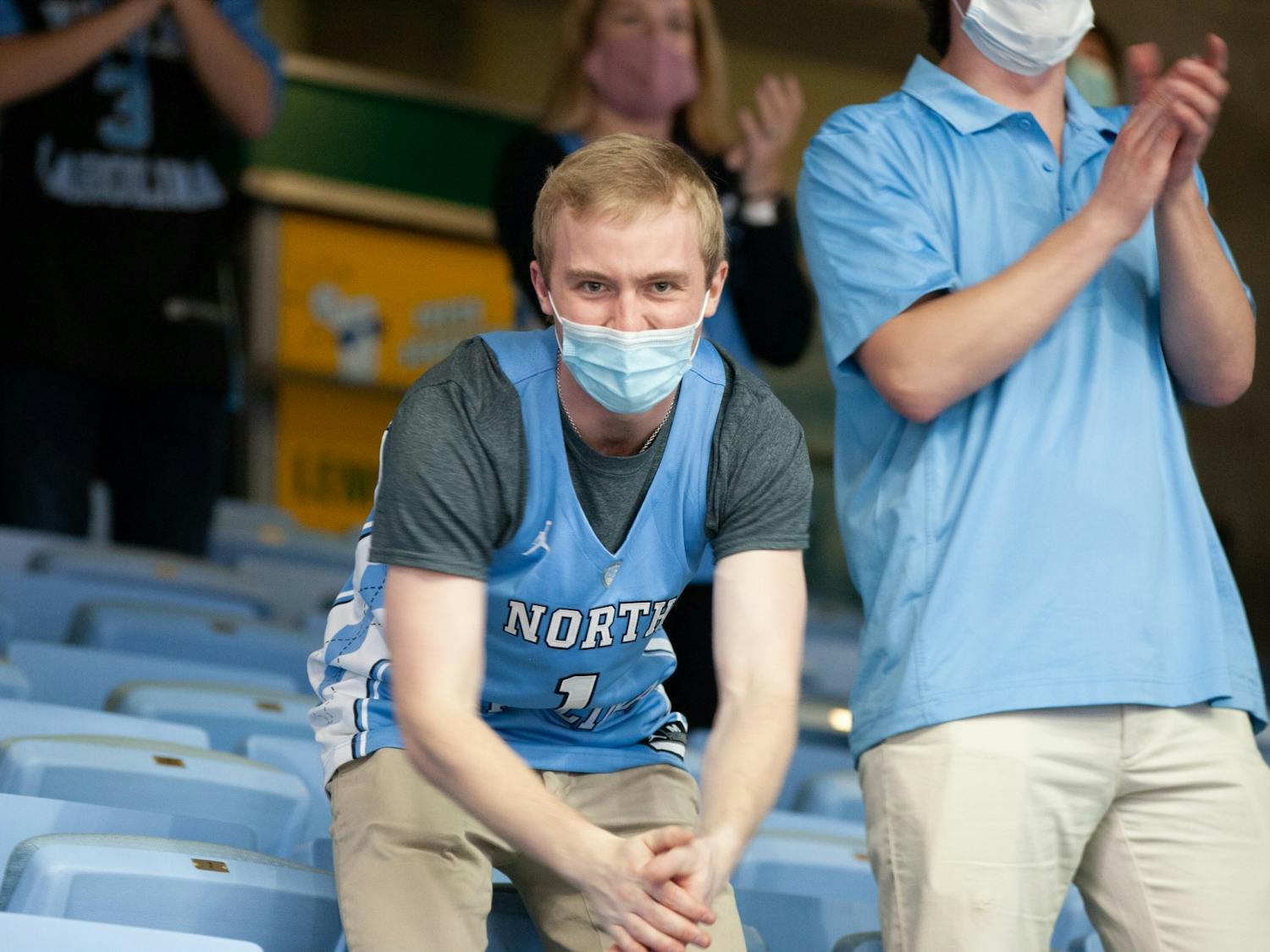 A fan celebrates a basket during UNC's 78-70 victory over Florida State in the Smith Center, Feb. 27, 2021. This was the first game this season for which fans were in attendance.