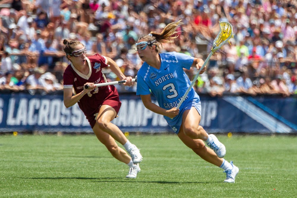 Fifth year attacker Jamie Ortega (3) fights off a defender during UNC's NCAA Tournament Championship Final against Boston College at Homewood Field in Baltimore, Md. on Sunday, May 29, 2022. UNC won 12-11.