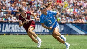 Fifth year attacker Jamie Ortega (3) fights off a defender during UNC's NCAA Tournament Championship Final against Boston College at Homewood Field in Baltimore, Md. on Sunday, May 29, 2022. UNC won 12-11.