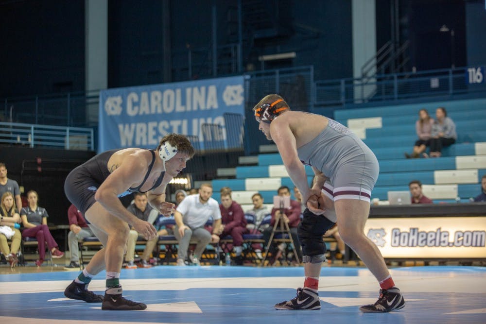 UNC senior Corey Daniel prepares to attempt a takedown during his bout against his Virginia Tech opponent  in Carnmichael Arena on Friday, Feb. 8, 2019. Daniel won his bout 3-2. Daniel's victory provided the points needed for UNC to further secure their lead and win the overall competition against Virginia Tech with a final score of 18-14.